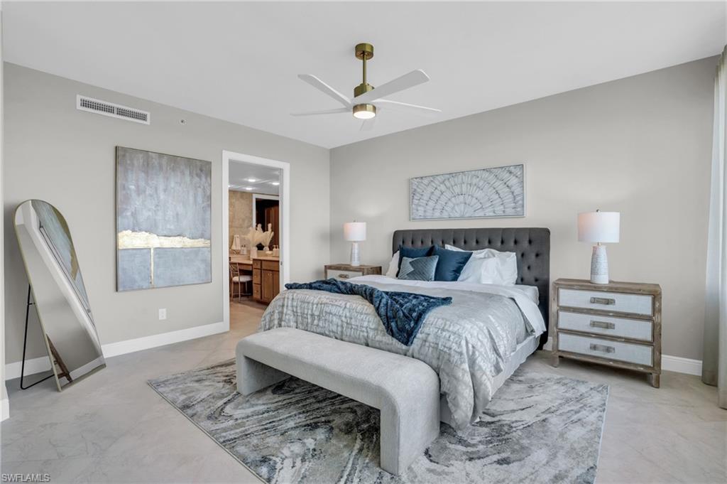 265 Indies Way, Unit 1402 Naples, FL 34110 - Photo 26 of 44 Bedroom featuring ceiling fan, light tile flooring, and ensuite bath