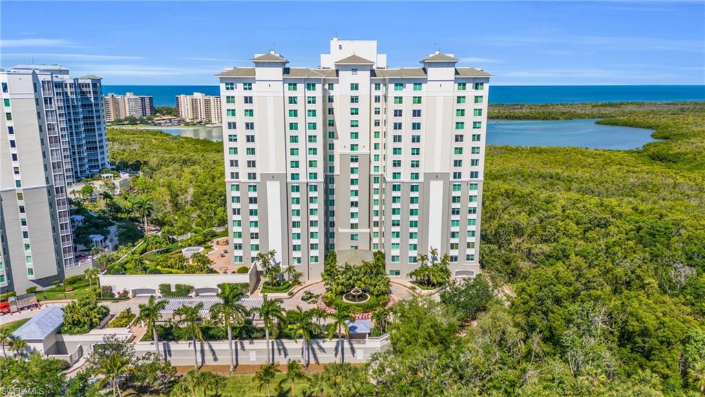 265 Indies Way, Unit 1402 Naples, FL 34110 - Photo 4 of 44 View of building exterior featuring a water view