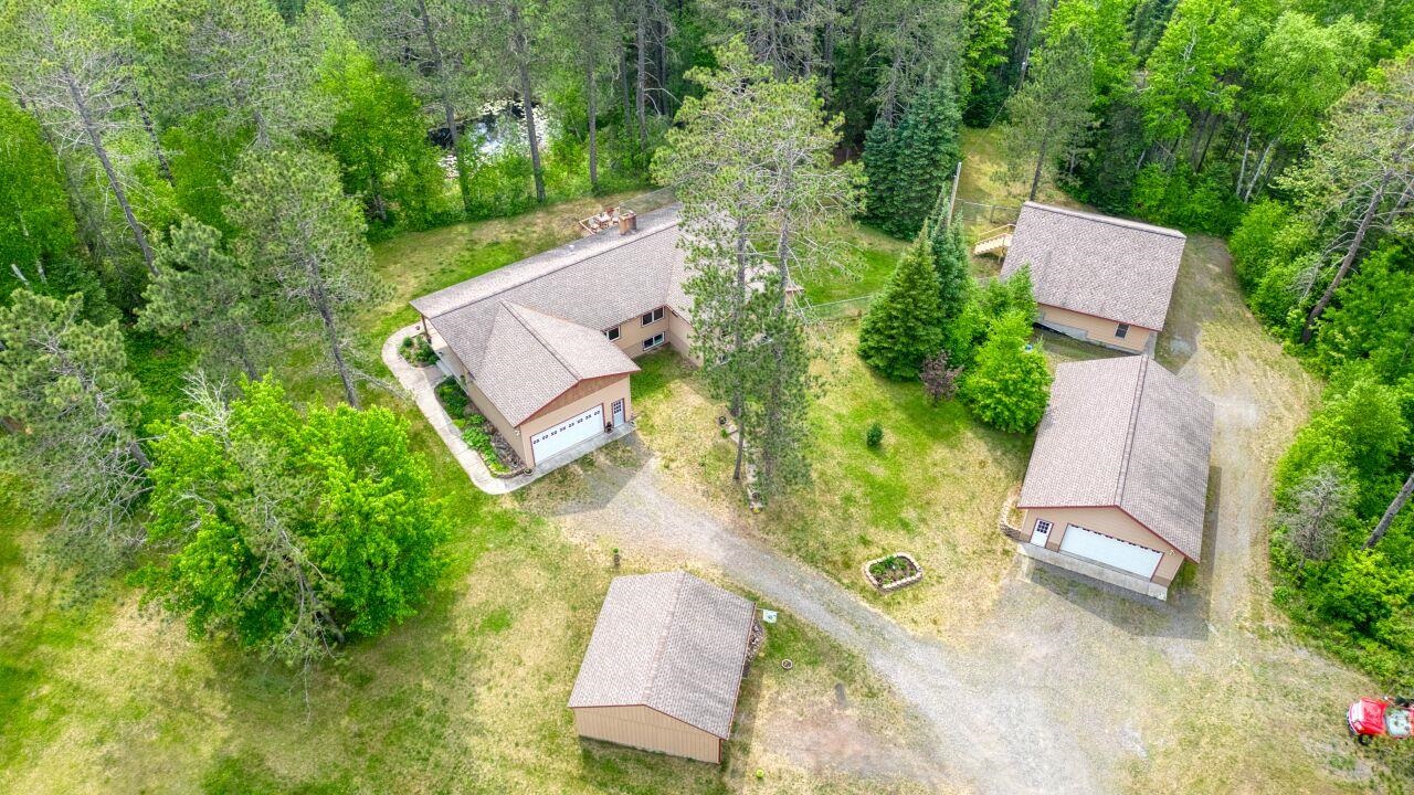 9220 Biss Road Britt, MN 55710 - Photo 44 of 50 Aerial view of property and surrounding area with a forest