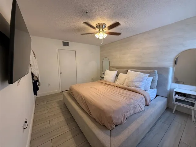 a bathroom with a granite countertop sink and mirror