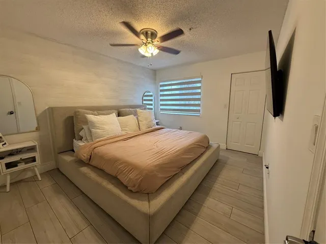 a bathroom with a shower and toilet