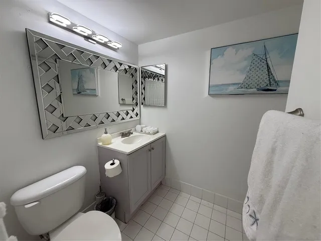 a room with gym equipment and a flat screen tv