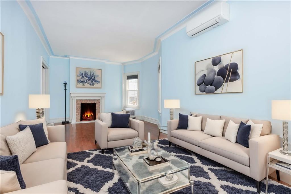 793 Westminster Road Brooklyn, NY 11230 - Photo 16 of 47 a living room with furniture a rug and a fireplace