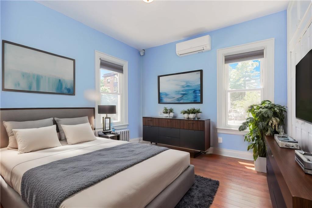 793 Westminster Road Brooklyn, NY 11230 - Photo 19 of 47 a bedroom with bed windows and a potted plant