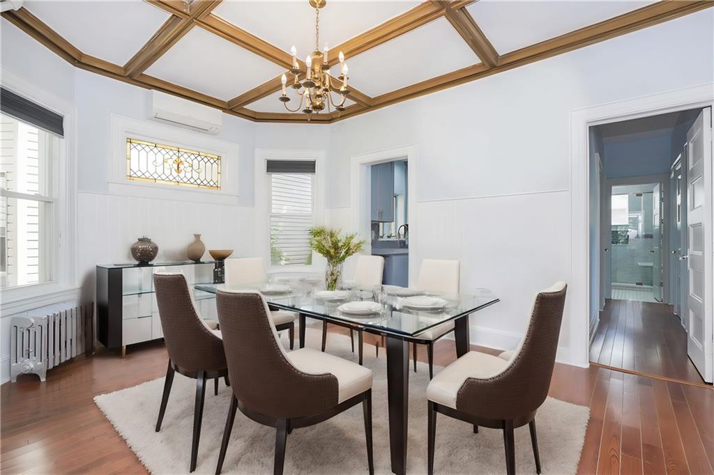793 Westminster Road Brooklyn, NY 11230 - Photo 21 of 47 a view of a dining room with furniture wooden floor and chandelier