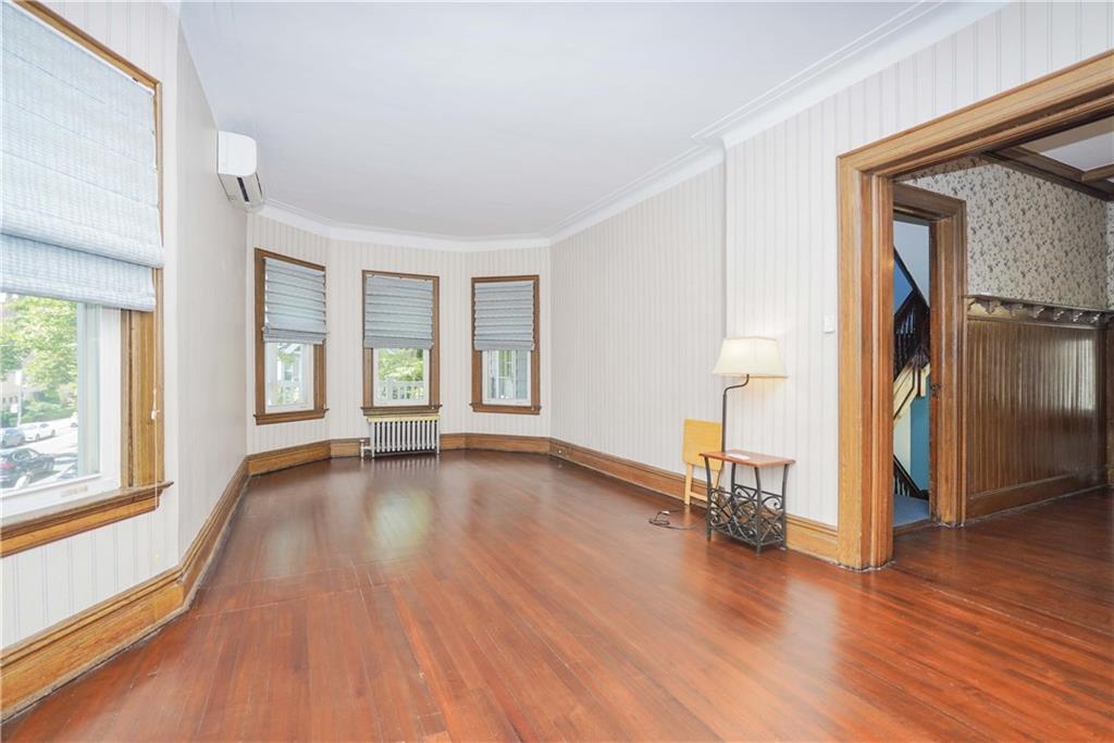 793 Westminster Road Brooklyn, NY 11230 - Photo 29 of 47 an empty room with wooden floor and windows