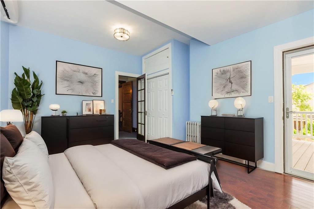 793 Westminster Road Brooklyn, NY 11230 - Photo 32 of 47 a bedroom with a bed and a flat screen tv