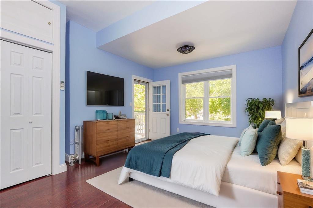 793 Westminster Road Brooklyn, NY 11230 - Photo 33 of 47 a bedroom with a bed and a flat screen tv