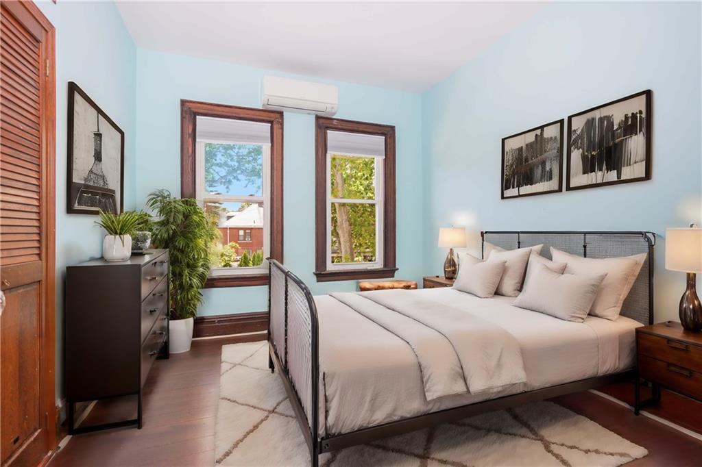 793 Westminster Road Brooklyn, NY 11230 - Photo 37 of 47 a bedroom with a bed potted plant and a window