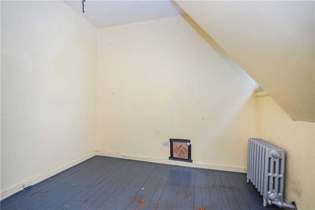 793 Westminster Road Brooklyn, NY 11230 - Photo 41 of 47 a view of an empty room with wooden floor