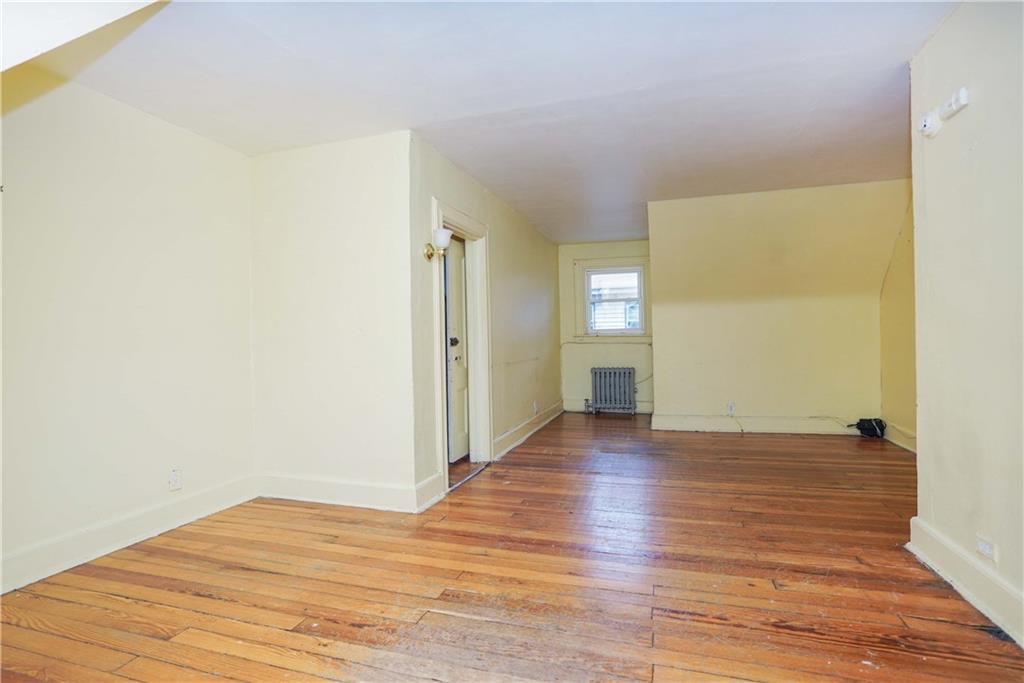 793 Westminster Road Brooklyn, NY 11230 - Photo 42 of 47 a view of an empty room with wooden floor and a window
