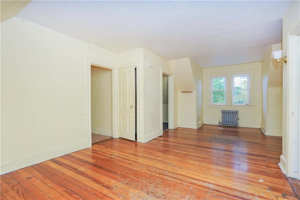 793 Westminster Road Brooklyn, NY 11230 - Photo 44 of 47 a view of a room with wooden floor and a bathroom