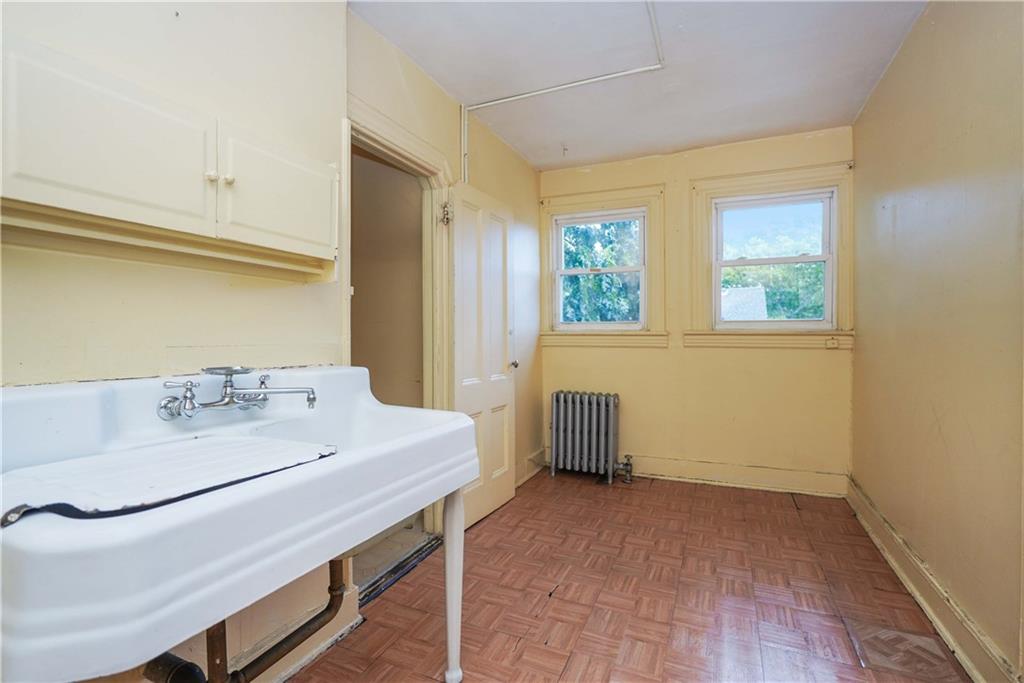 793 Westminster Road Brooklyn, NY 11230 - Photo 45 of 47 a room with a window and a table