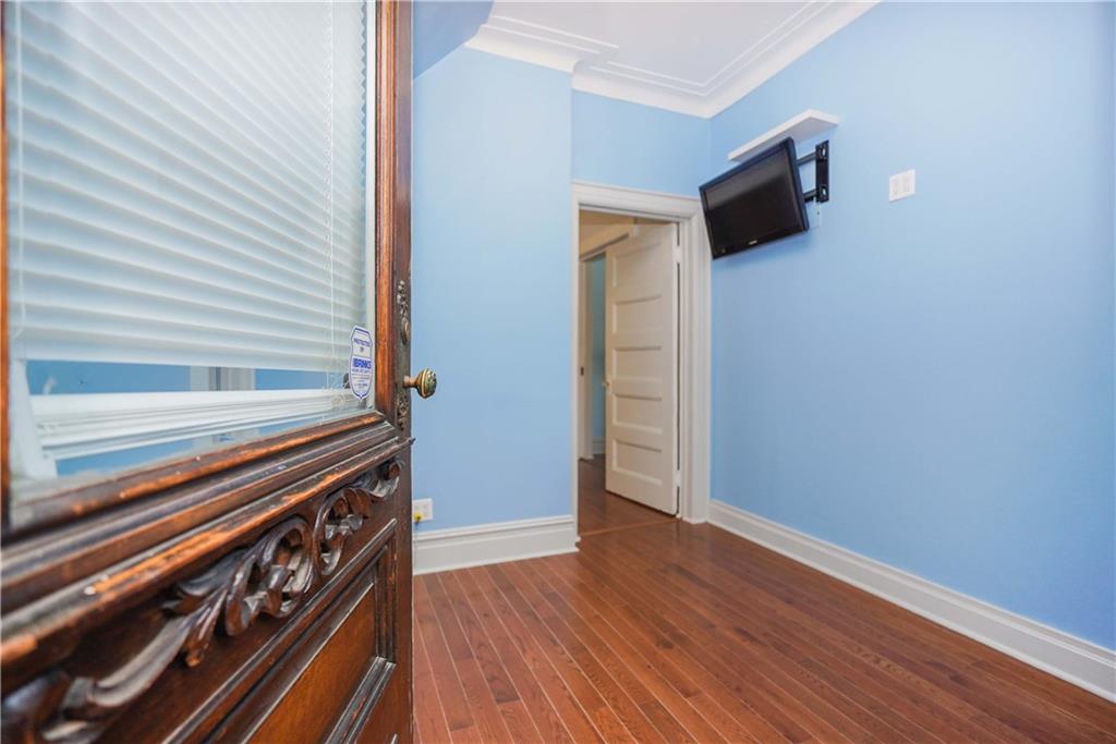 793 Westminster Road Brooklyn, NY 11230 - Photo 8 of 47 a view of an empty room with wooden floor