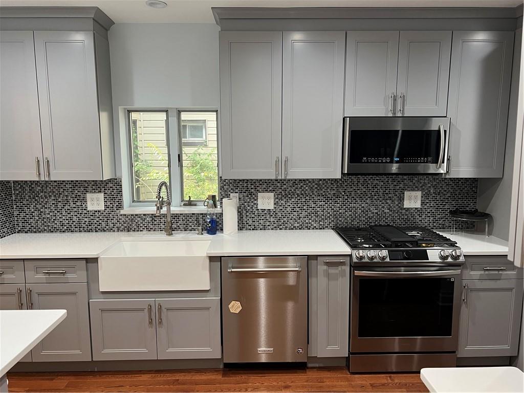 793 Westminster Road Brooklyn, NY 11230 - Photo 10 of 47 a kitchen with granite countertop a stove and a microwave
