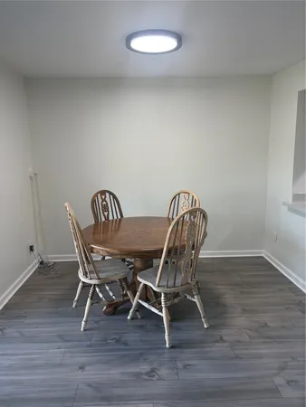 a kitchen with stainless steel appliances granite countertop a sink a stove a refrigerator with grey cabinets