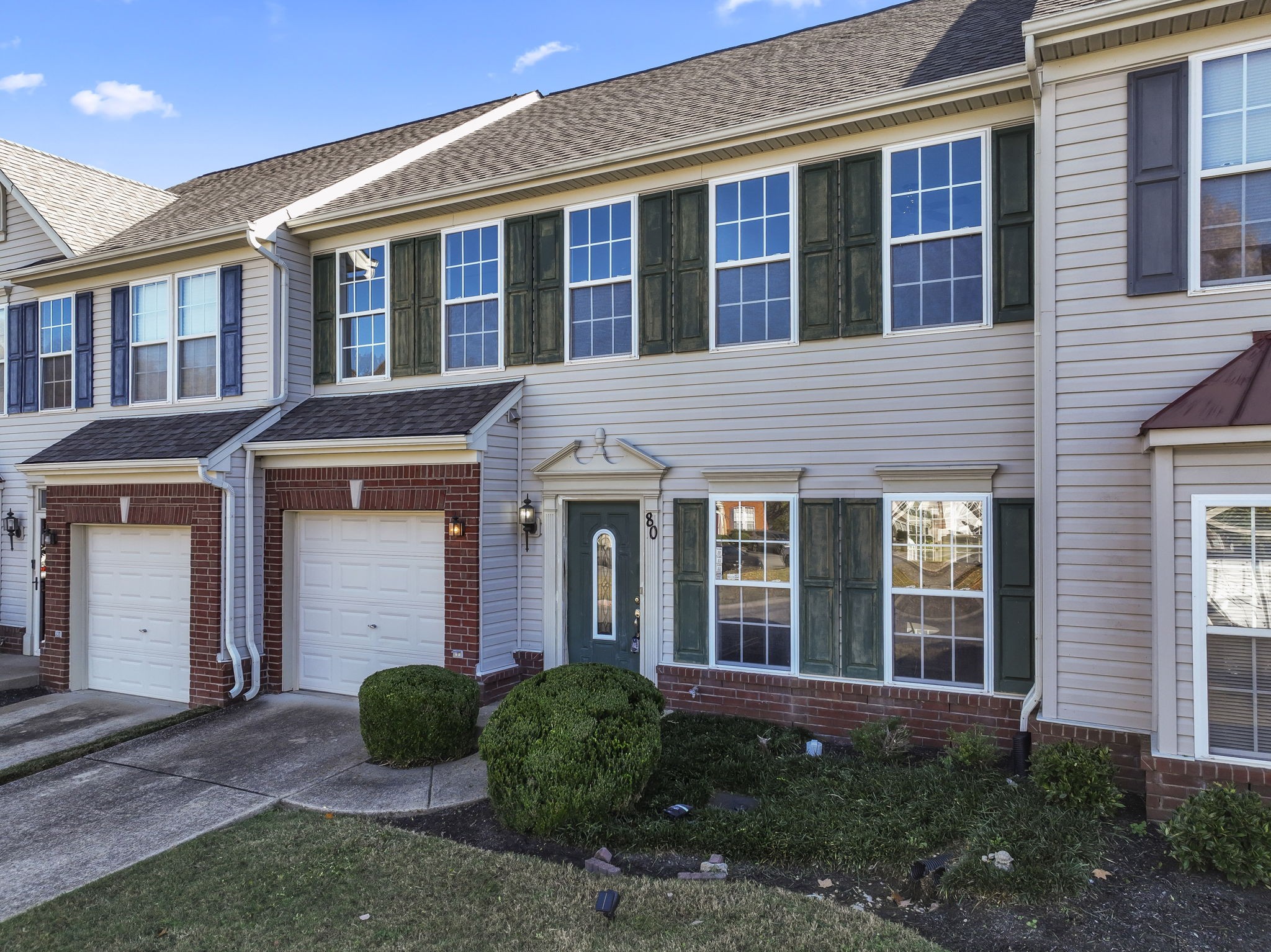 3401 Anderson Road, Unit 80 Antioch, TN 37013 - Photo 1 of 39 a view of a brick house with many windows and plants