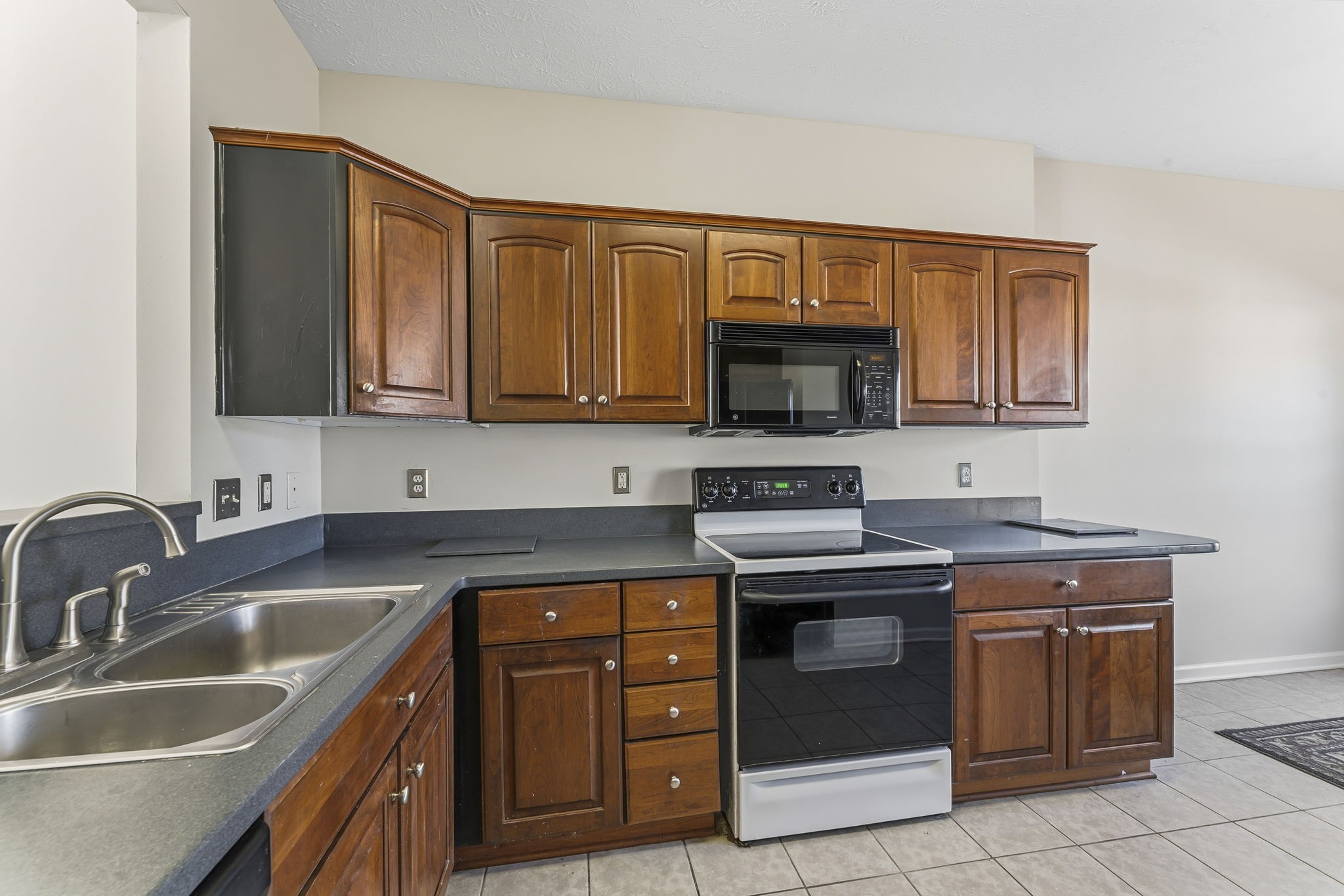 3401 Anderson Road, Unit 80 Antioch, TN 37013 - Photo 11 of 39 a kitchen with stainless steel appliances granite countertop a sink stove and microwave