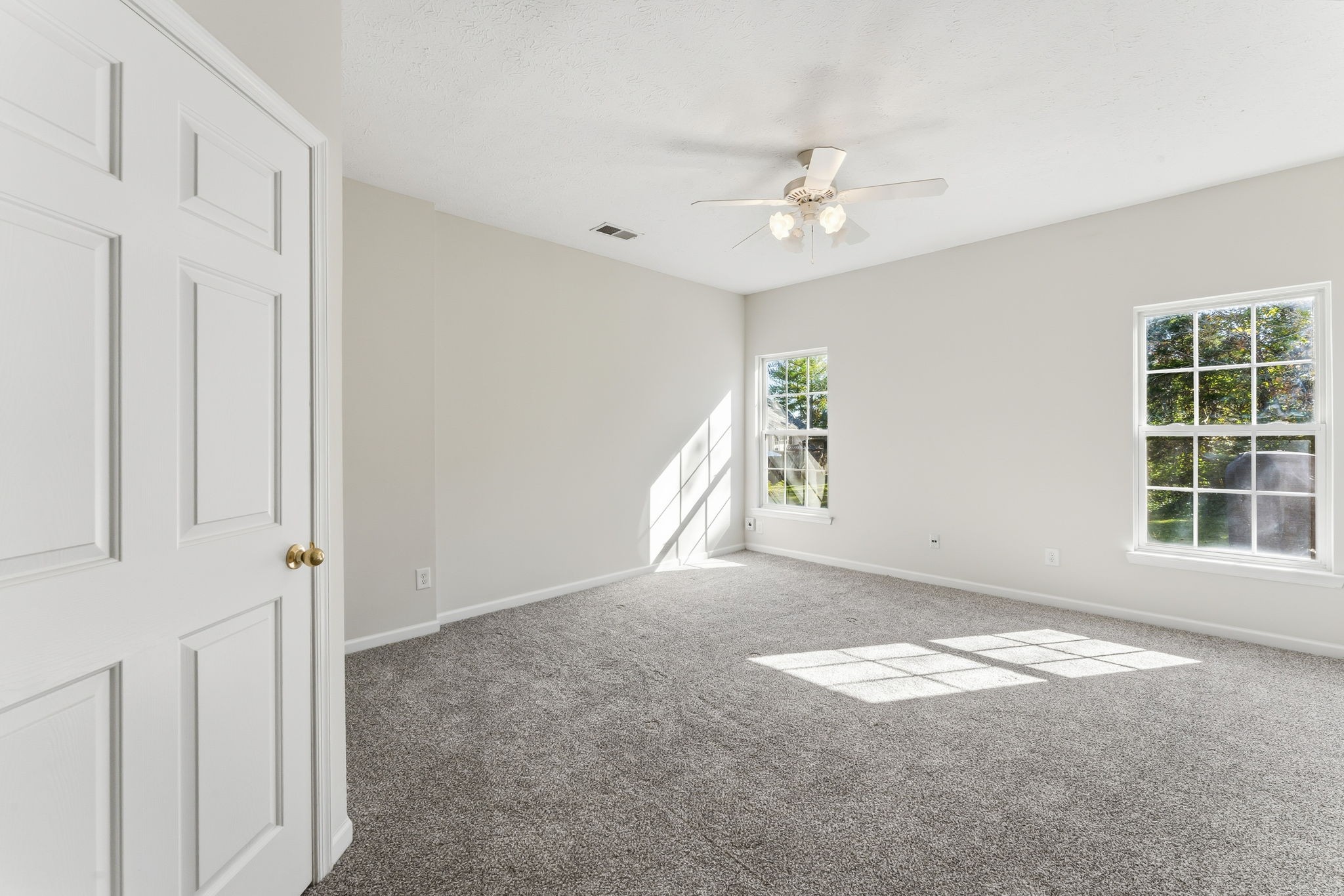 3401 Anderson Road, Unit 80 Antioch, TN 37013 - Photo 20 of 39 en empty room with windows and ceiling fan
