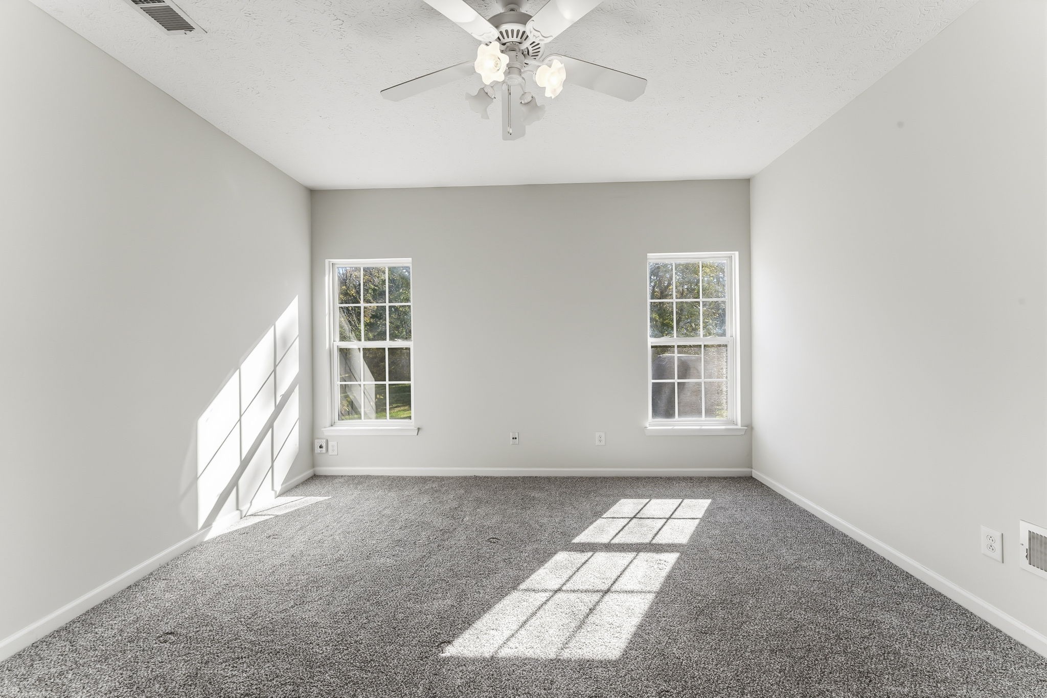 3401 Anderson Road, Unit 80 Antioch, TN 37013 - Photo 21 of 39 an empty room with windows and ceiling fan