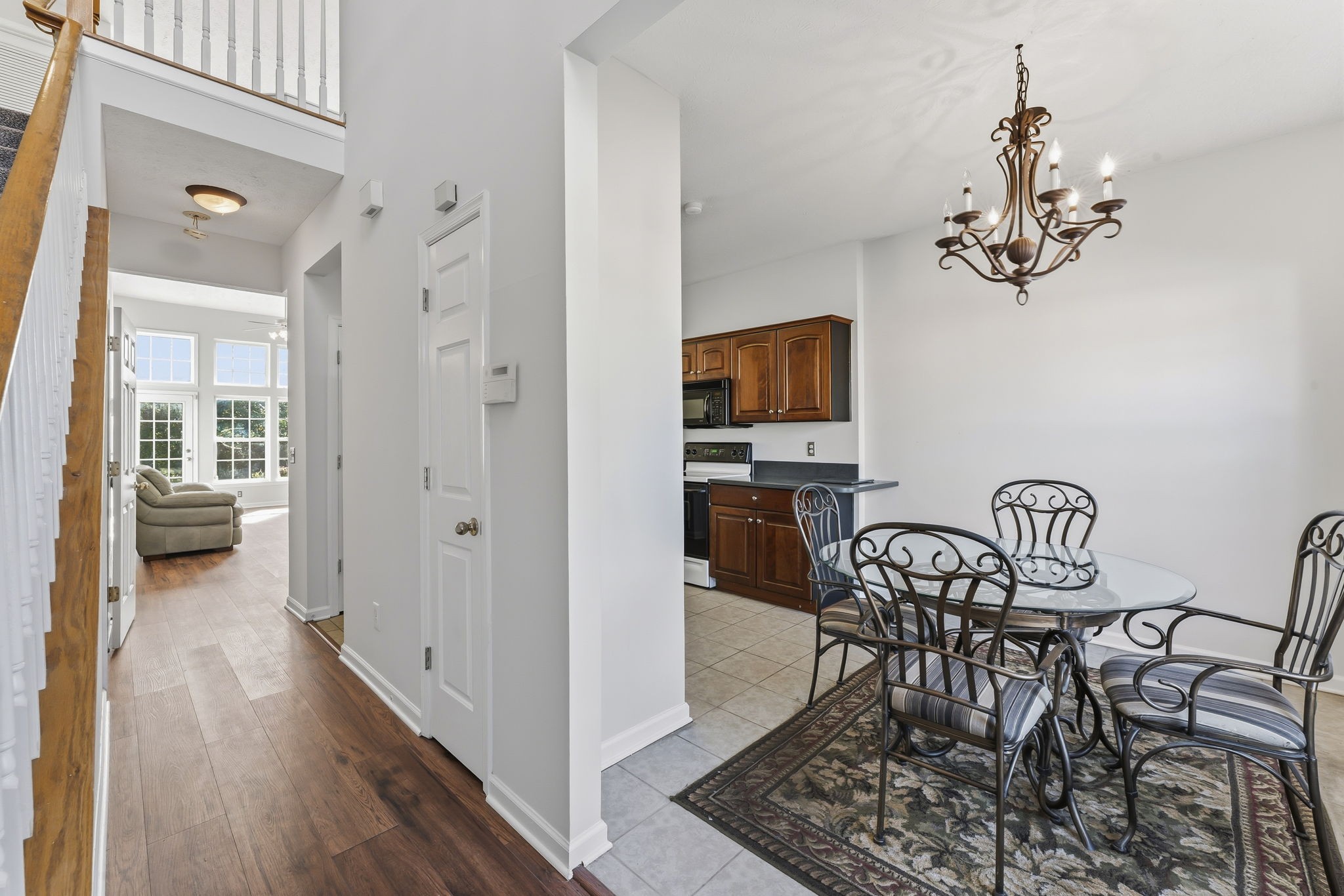 3401 Anderson Road, Unit 80 Antioch, TN 37013 - Photo 5 of 39 a view of a dining room with furniture wooden floor and a chandelier