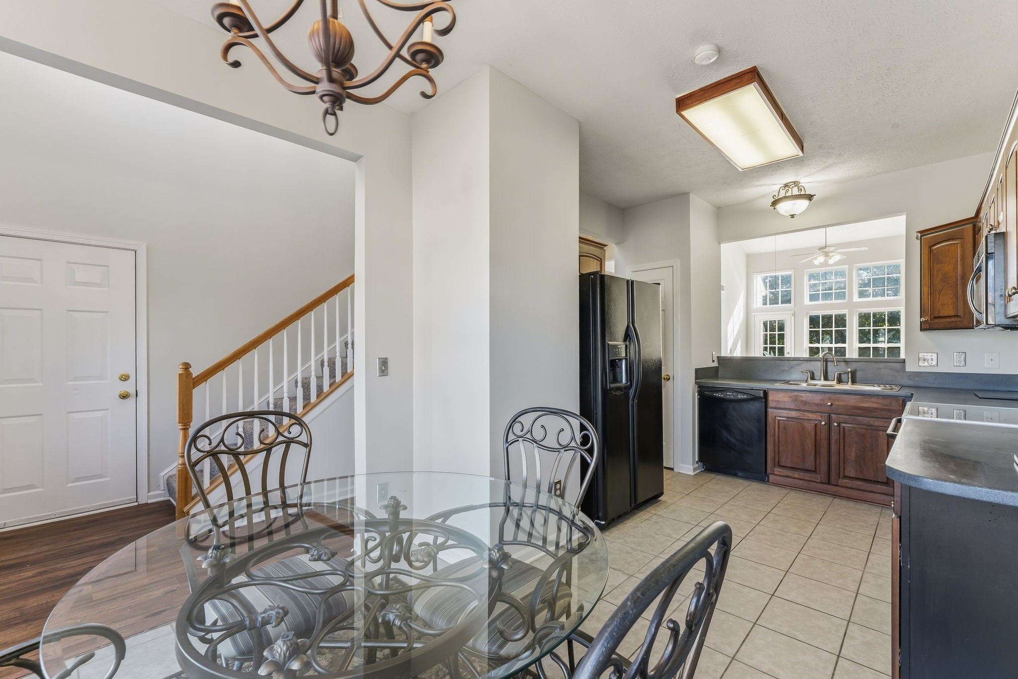3401 Anderson Road, Unit 80 Antioch, TN 37013 - Photo 8 of 39 a view of a dining room with furniture a chandelier and wooden floor