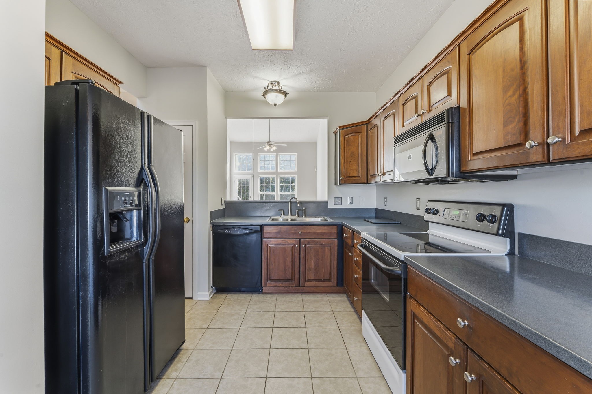 3401 Anderson Road, Unit 80 Antioch, TN 37013 - Photo 9 of 39 a kitchen with stainless steel appliances granite countertop a refrigerator stove and sink