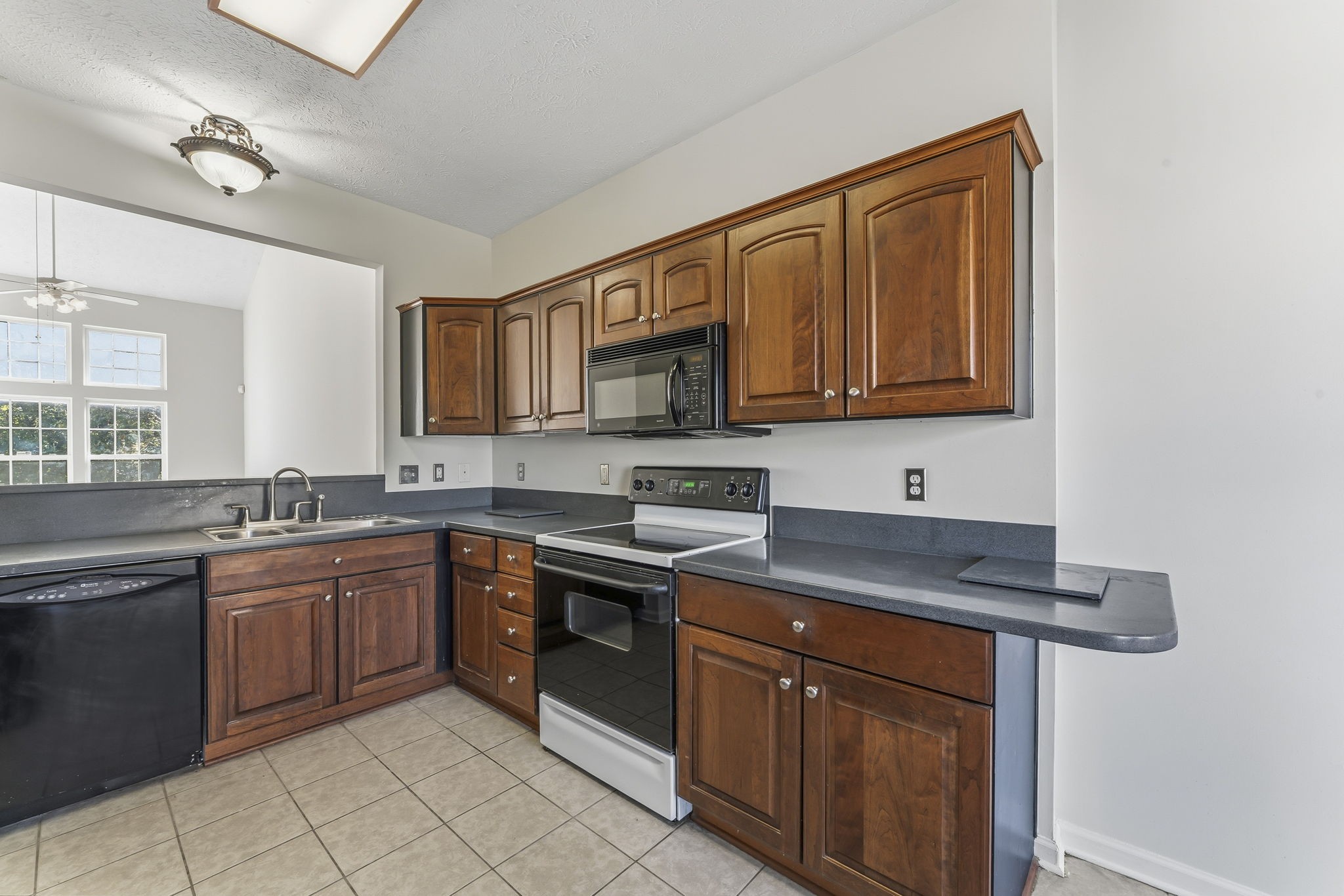 3401 Anderson Road, Unit 80 Antioch, TN 37013 - Photo 10 of 39 a kitchen with stainless steel appliances granite countertop a stove sink and cabinets