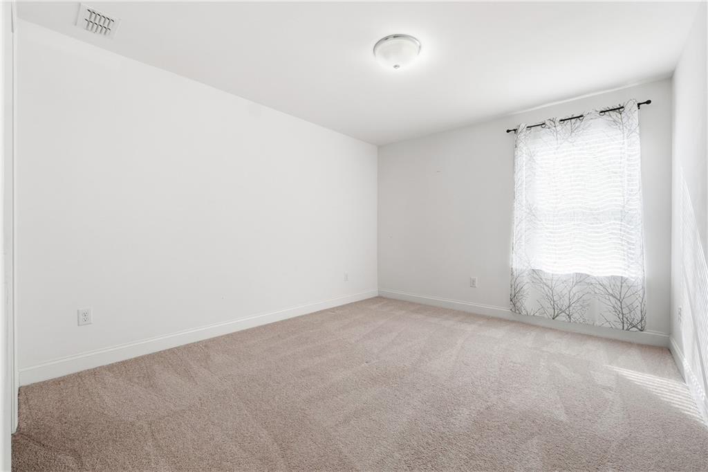 3425 Hardy Street Cumming, GA 30041 - Photo 13 of 25 a view of an empty room and window