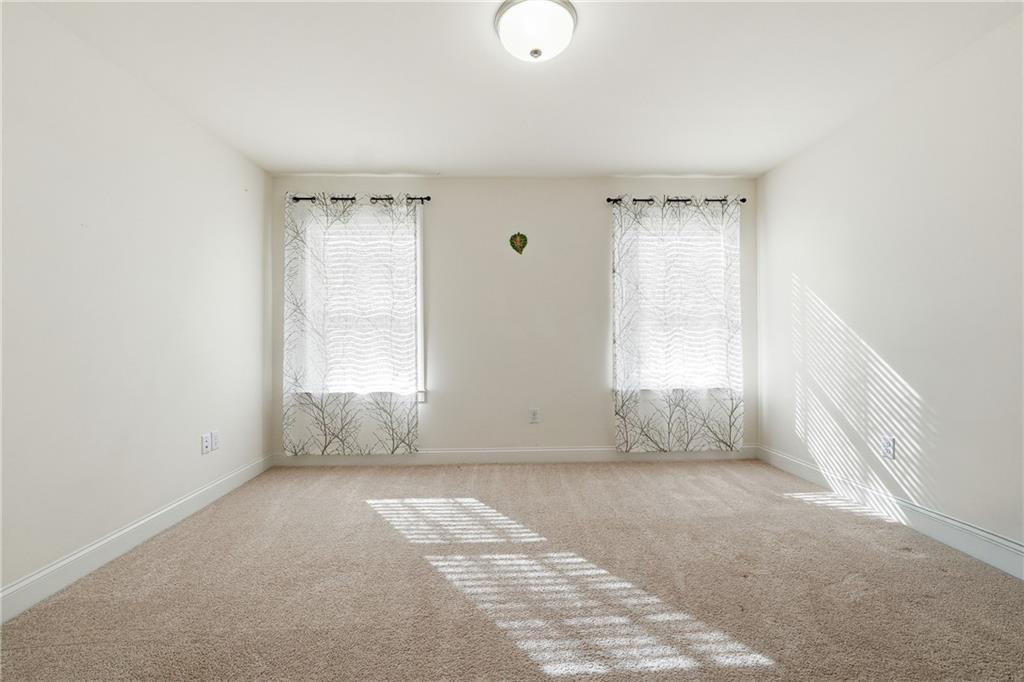 3425 Hardy Street Cumming, GA 30041 - Photo 18 of 25 an empty room with windows