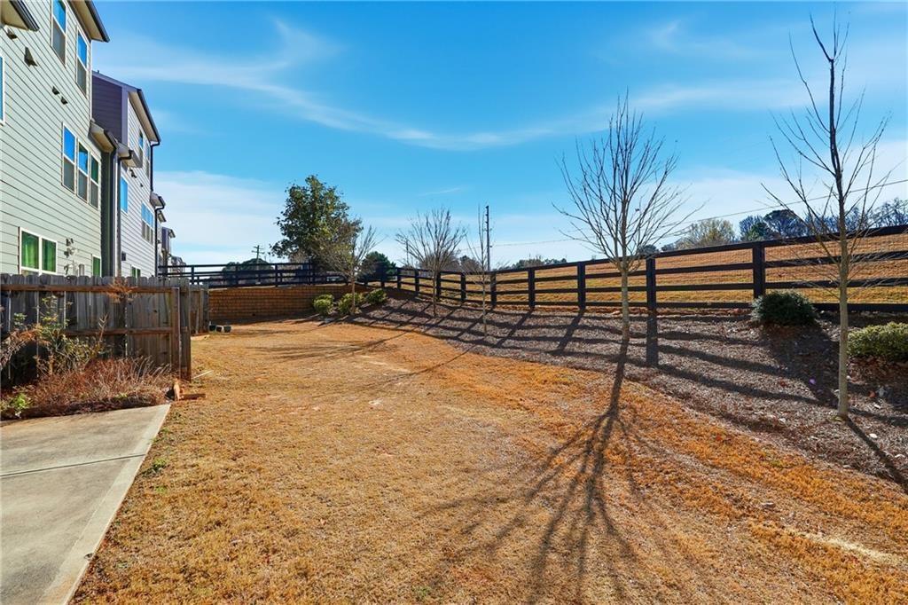 3425 Hardy Street Cumming, GA 30041 - Photo 25 of 25 a view of a yard with wooden fence