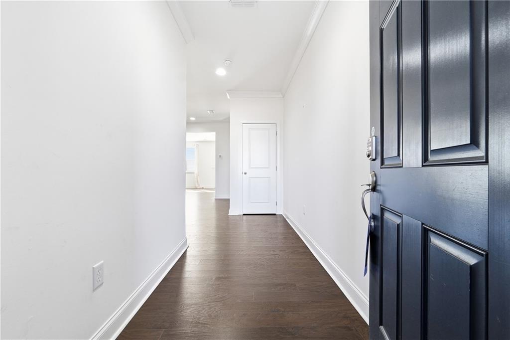 3425 Hardy Street Cumming, GA 30041 - Photo 3 of 25 a view of a hallway with wooden floor