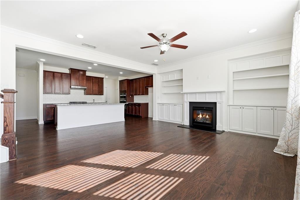 3425 Hardy Street Cumming, GA 30041 - Photo 4 of 25 a living room with furniture and a fireplace