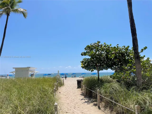a view of a lake with a building in the background