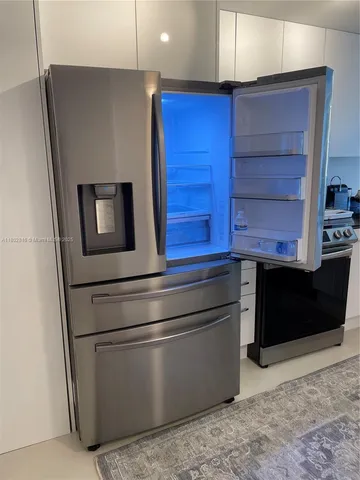 a refrigerator freezer sitting in a kitchen