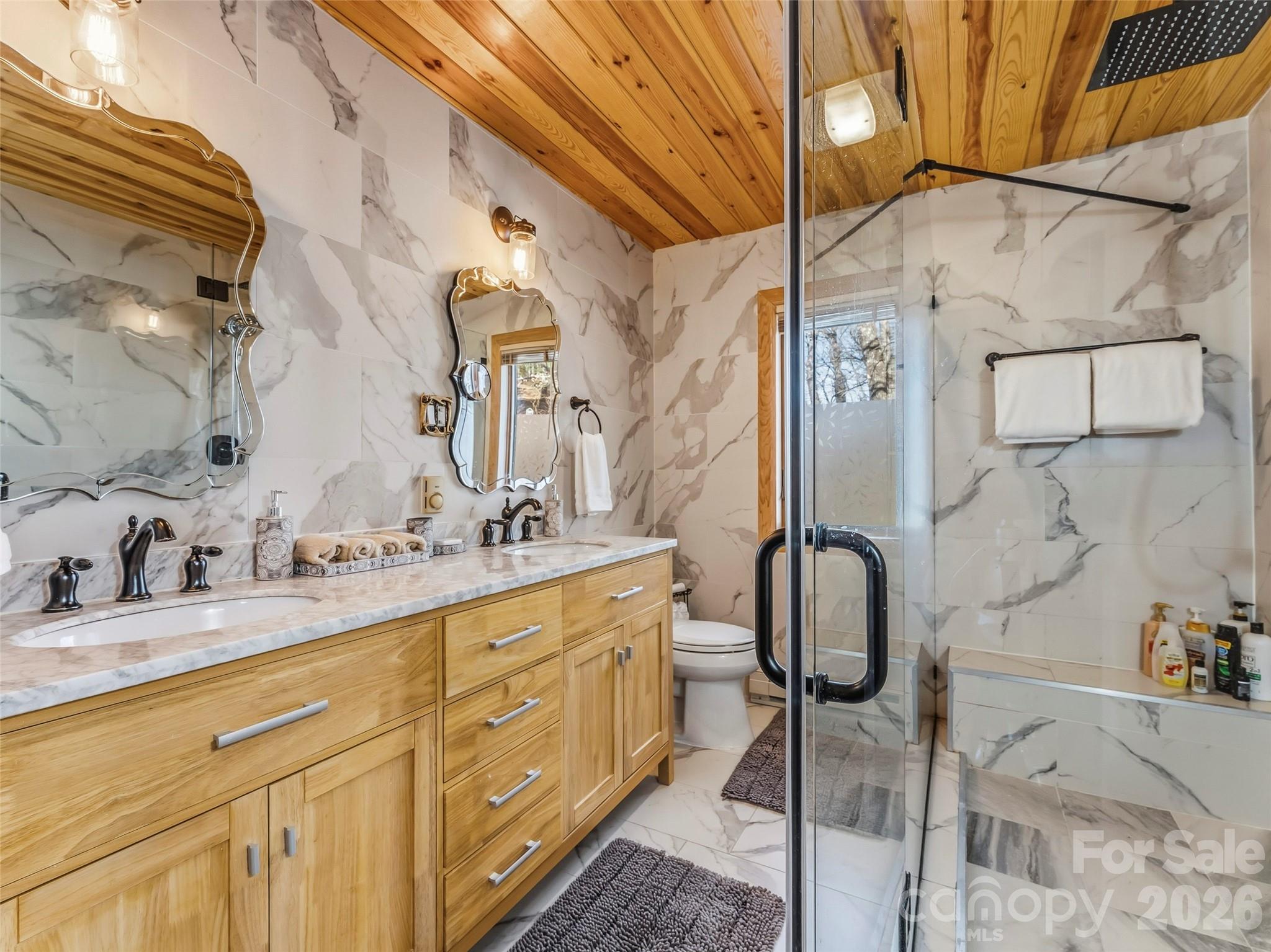 101 Ruffed Grouse Road Brevard, NC 28712 - Photo 19 of 38 a bathroom with a granite countertop sink and a mirror