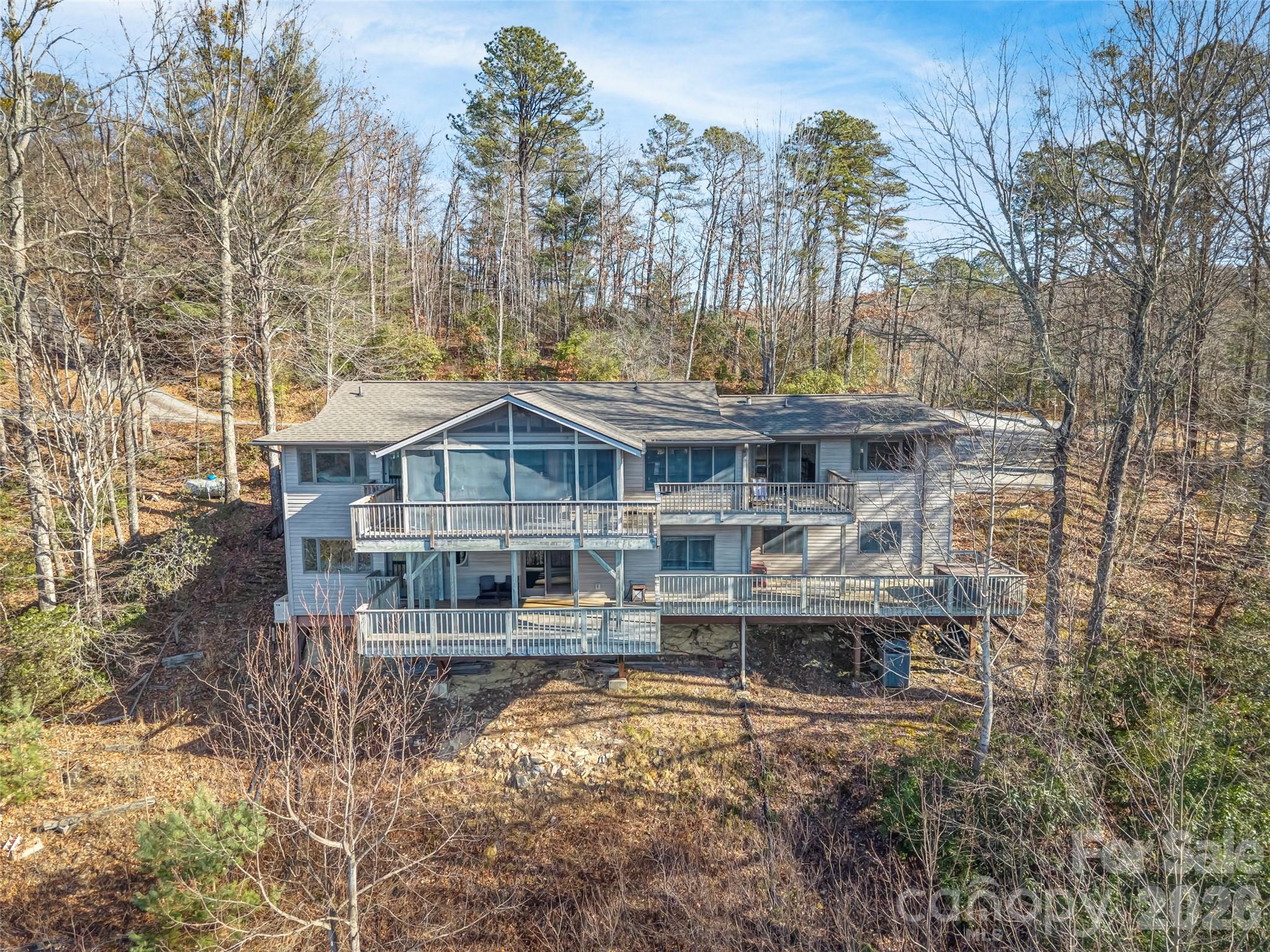 101 Ruffed Grouse Road Brevard, NC 28712 - Photo 2 of 38 a front view of a house with swimming pool