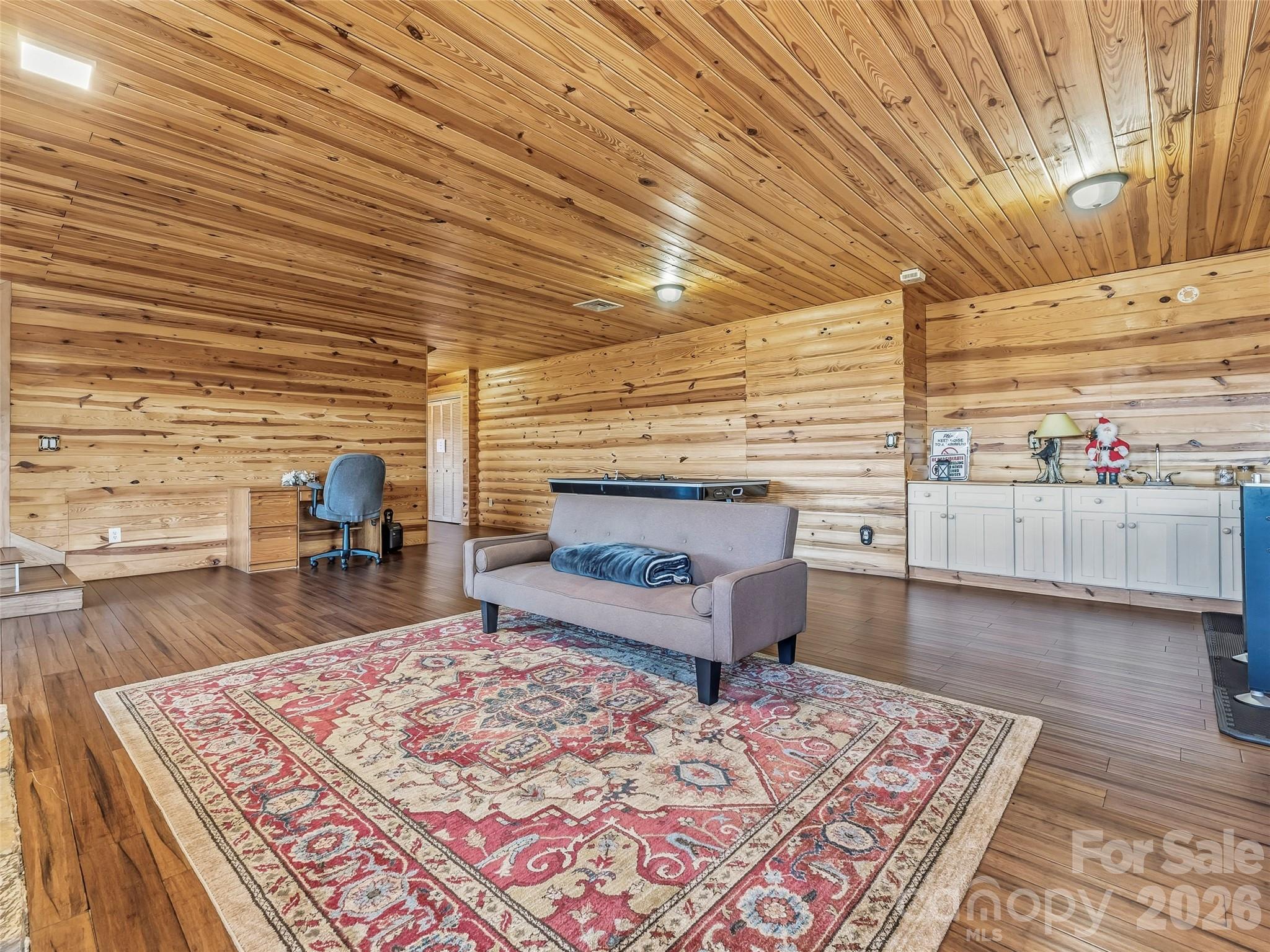 101 Ruffed Grouse Road Brevard, NC 28712 - Photo 30 of 38 a living room with furniture and a wooden floor