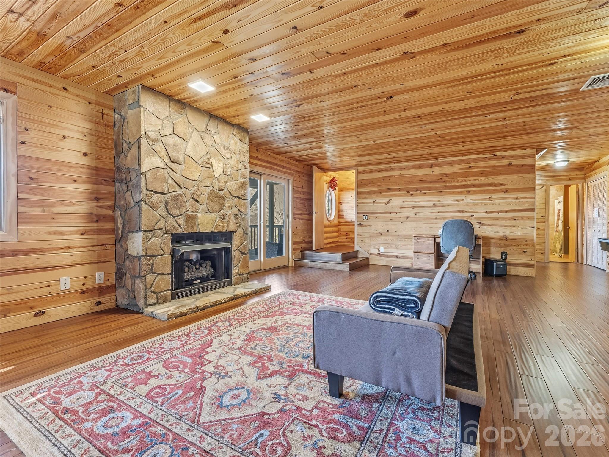101 Ruffed Grouse Road Brevard, NC 28712 - Photo 31 of 38 a living room with furniture and a fireplace