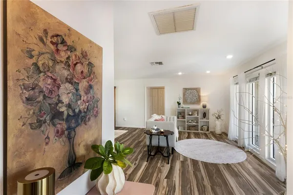 a living room with furniture and a large window