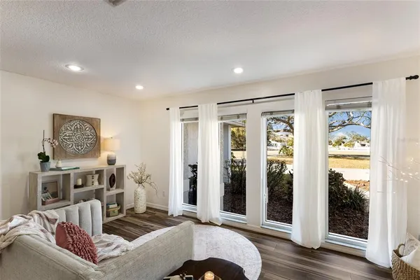 a living room with furniture a fireplace and a table