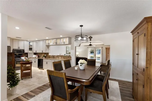 a bath tub sitting in a bathroom next to a window