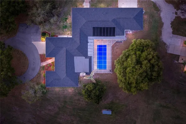 a dining room with furniture and a potted plant