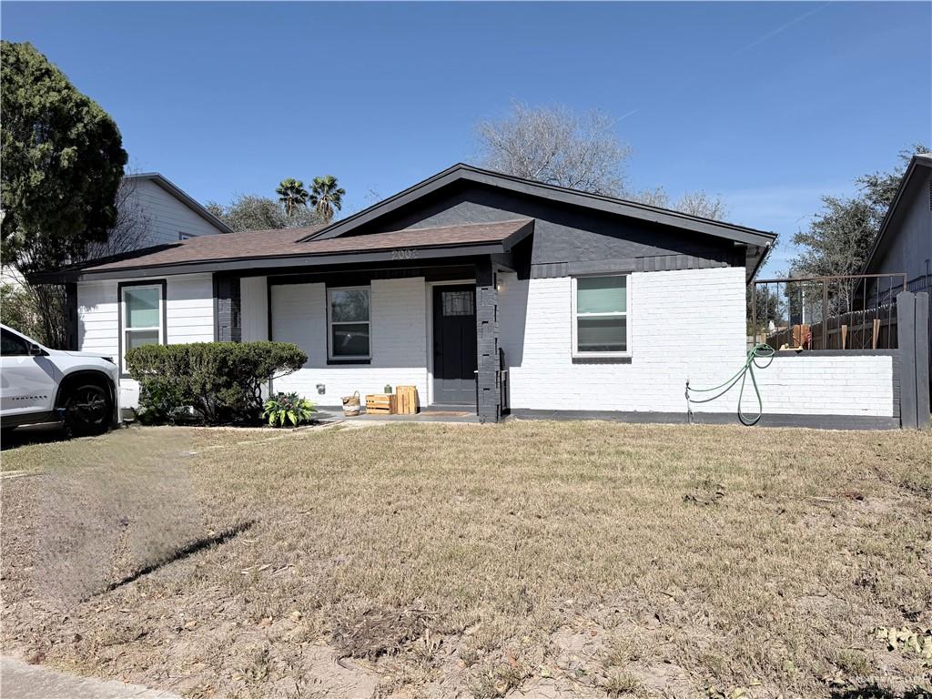 2004 Hawk Avenue McAllen, TX 78504 - Photo 1 of 8 a front view of a house with garden