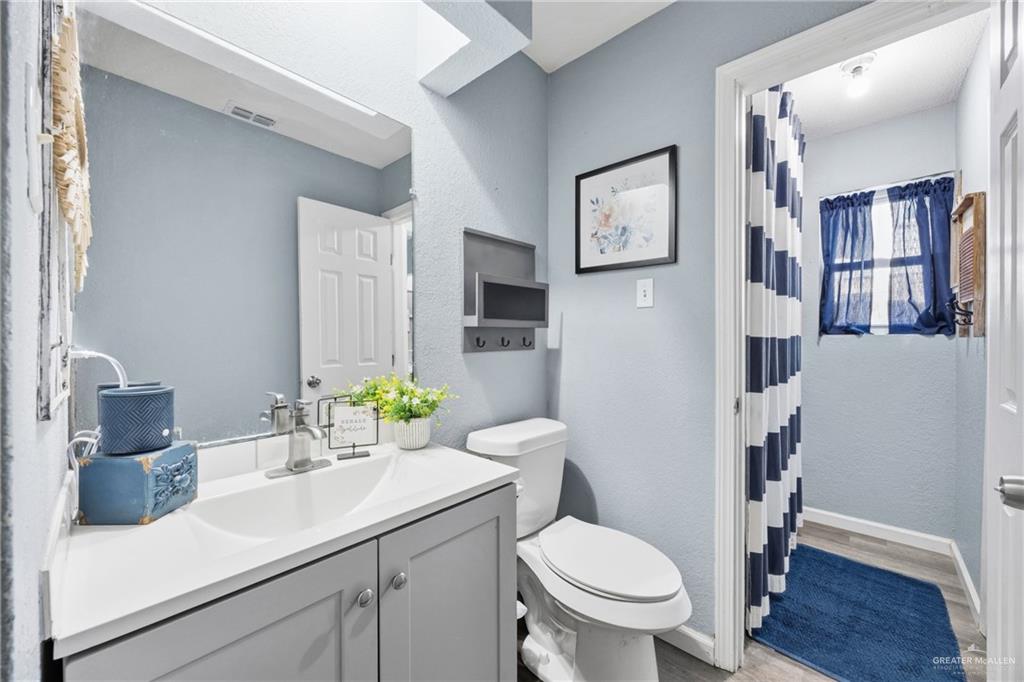 2004 Hawk Avenue McAllen, TX 78504 - Photo 12 of 15 a bathroom with a sink toilet and shower