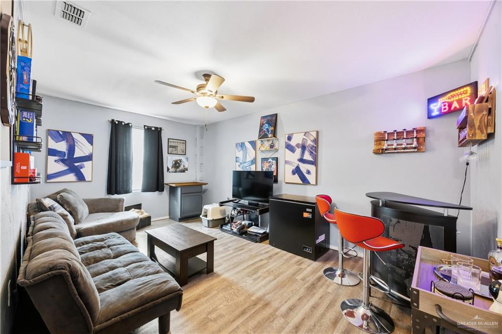 2004 Hawk Avenue McAllen, TX 78504 - Photo 14 of 15 a living room with furniture and a flat screen tv