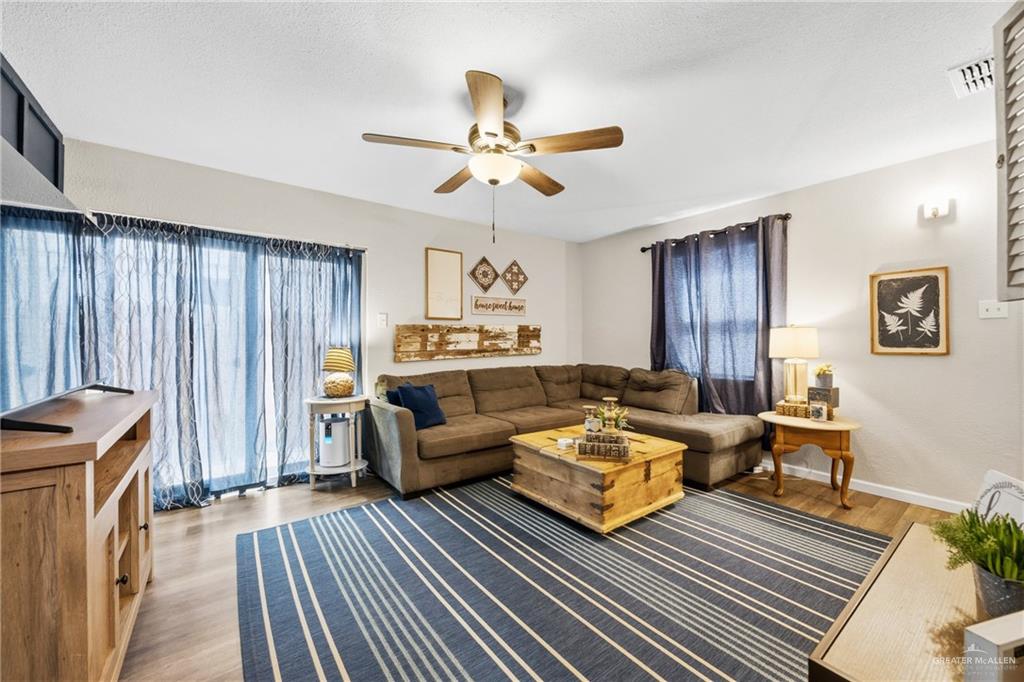 2004 Hawk Avenue McAllen, TX 78504 - Photo 2 of 15 a living room with furniture and a rug