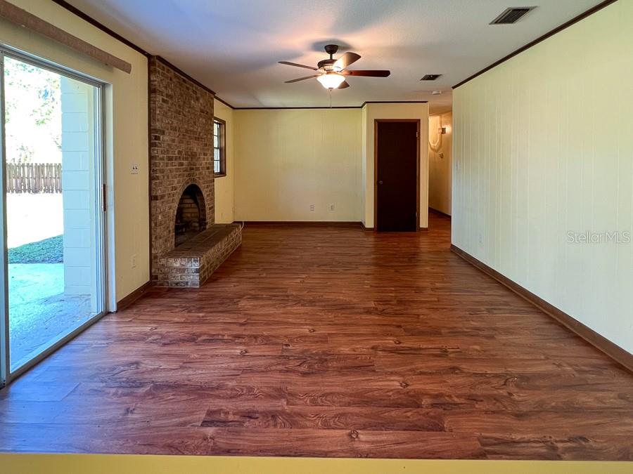 2915 Northwest 31 Terrace Gainesville, FL 32605 - Photo 12 of 33 a view of livingroom with hardwood floor and a ceiling fan