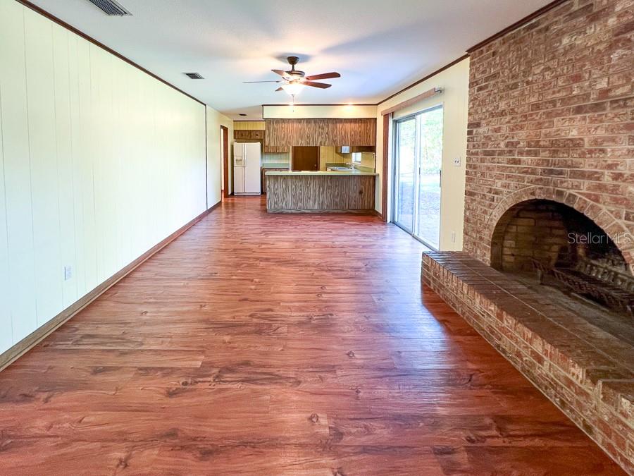2915 Northwest 31 Terrace Gainesville, FL 32605 - Photo 24 of 33 a view of kitchen and hall with wooden floor