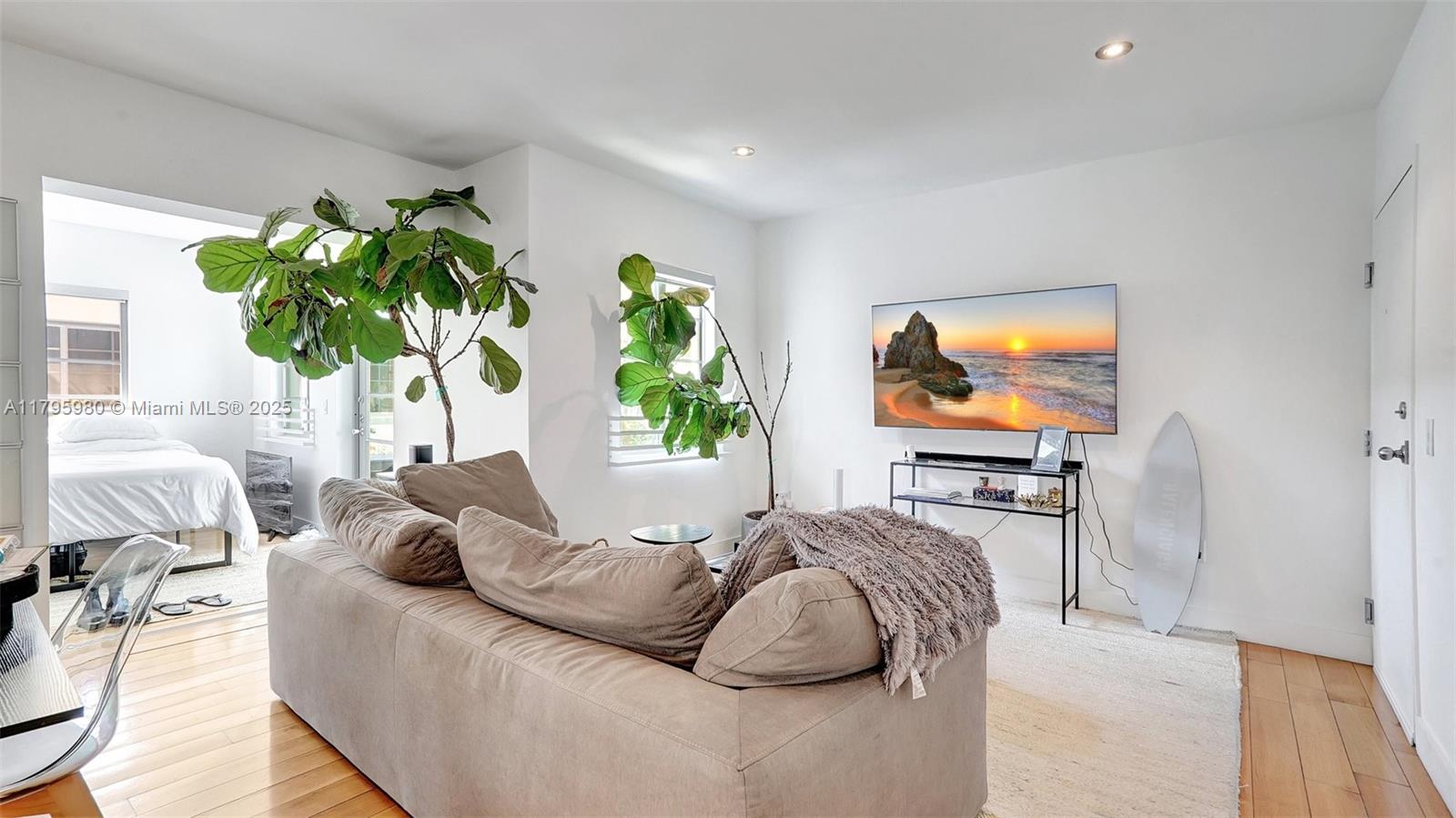 Flamingo-Lummus Miami Beach, FL 33139 - Photo 11 of 63 a living room with furniture and a flat screen tv